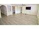 Living room with wood-look floors, and access to other rooms at 6101 34Th W St # 1E, Bradenton, FL 34210