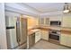 Modern kitchen with stainless steel appliances and light wood floors at 6101 34Th W St # 1E, Bradenton, FL 34210