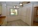 Bright dining area with light wood-look floors and window at 6101 34Th W St # 1E, Bradenton, FL 34210