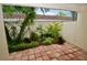 Landscaped patio with tile flooring and garden views at 6101 34Th W St # 1E, Bradenton, FL 34210