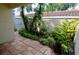 Private patio with lush landscaping and tile flooring at 6101 34Th W St # 1E, Bradenton, FL 34210