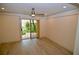 Bedroom with wood-look floors and access to a private patio at 6101 34Th W St # 1E, Bradenton, FL 34210