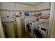 Laundry room with washer, dryer, and water softener at 6101 34Th W St # 1E, Bradenton, FL 34210