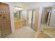 Bathroom boasts a large vanity, soaking tub, and walk-in shower at 6101 34Th W St # 1E, Bradenton, FL 34210