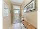 Bright and airy entryway with tiled floors and coastal decor at 2002 Bal Harbor Blvd # 1311, Punta Gorda, FL 33950