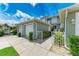 Two-car garage with lush landscaping, inviting entryway to condo at 2002 Bal Harbor Blvd # 1311, Punta Gorda, FL 33950