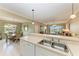 Bright kitchen with white cabinets, breakfast bar, and stainless steel appliances at 2002 Bal Harbor Blvd # 1311, Punta Gorda, FL 33950