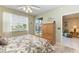Bedroom with a queen bed, access to balcony, and built-in storage at 2002 Bal Harbor Blvd # 1311, Punta Gorda, FL 33950