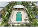 Community pool and spa with lounge chairs at 2002 Bal Harbor Blvd # 1311, Punta Gorda, FL 33950