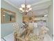Dining area with glass table and kitchen views at 2002 Bal Harbor Blvd # 1311, Punta Gorda, FL 33950