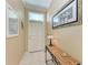 Neutral-toned entryway with tiled floors and a console table at 2002 Bal Harbor Blvd # 1311, Punta Gorda, FL 33950