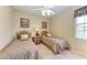 Bedroom with two twin beds, nightstand, and ceiling fan at 2002 Bal Harbor Blvd # 1311, Punta Gorda, FL 33950
