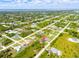 Aerial view showing home's location in a residential neighborhood at 12154 Van Loon Ave, Port Charlotte, FL 33981