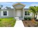 New home with front porch and walkway leading to front door at 12154 Van Loon Ave, Port Charlotte, FL 33981
