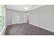 Bright bedroom with large window, closet, and ceiling fan at 12154 Van Loon Ave, Port Charlotte, FL 33981