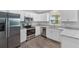 Modern kitchen with stainless steel appliances and granite countertops at 12154 Van Loon Ave, Port Charlotte, FL 33981