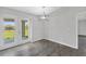 Bright dining area with tile flooring and glass doors leading to backyard at 12154 Van Loon Ave, Port Charlotte, FL 33981