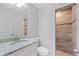 Clean bathroom with granite countertop, white cabinets, and walk-in shower at 12154 Van Loon Ave, Port Charlotte, FL 33981