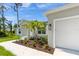 New home with walkway leading to front door and nicely landscaped at 12154 Van Loon Ave, Port Charlotte, FL 33981