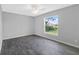 Spacious bedroom with window and ceiling fan at 12154 Van Loon Ave, Port Charlotte, FL 33981