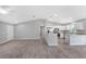 Open floor plan with kitchen, breakfast bar, and spacious living room at 12154 Van Loon Ave, Port Charlotte, FL 33981