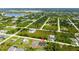 Aerial view of a house in a residential neighborhood at 12154 Van Loon Ave, Port Charlotte, FL 33981
