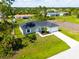 Single-Gathering home with a two-car garage and landscaped yard at 12154 Van Loon Ave, Port Charlotte, FL 33981
