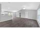 Open concept living room with high ceilings and wood-look tile floors at 12154 Van Loon Ave, Port Charlotte, FL 33981