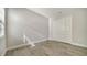 Bright bedroom with wood-look flooring and a double-door closet at 429 Alberata Way, Nokomis, FL 34275