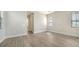 Bedroom featuring wood-look floors, and ensuite access at 429 Alberata Way, Nokomis, FL 34275