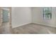 Bedroom featuring tile floor, neutral colors, and ensuite access to a bathroom at 429 Alberata Way, Nokomis, FL 34275