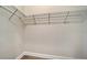 Empty walk-in closet with wire shelves and baseboard at 429 Alberata Way, Nokomis, FL 34275