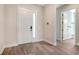 Bright foyer with attractive floors, a modern front door, and access to other rooms at 429 Alberata Way, Nokomis, FL 34275