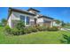 Beautiful one-story home featuring stone accents, a two-car garage, and a well-maintained lawn and landscaping at 429 Alberata Way, Nokomis, FL 34275