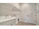 Laundry room with sink, closet and wire rack at 429 Alberata Way, Nokomis, FL 34275
