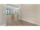 Open floor plan with a view of the lake through sliding glass doors at 429 Alberata Way, Nokomis, FL 34275