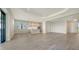 Bright, open concept living room and kitchen with tile floors, recessed lighting, and stainless appliances at 429 Alberata Way, Nokomis, FL 34275