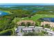 A beautiful condo community overlooks the golf course and bay, enhanced by lush landscaping and covered parking at 7607 Grand Estuary Trl # 205, Bradenton, FL 34212