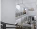 Open living area with loft and modern lighting fixtures at 2344 Bay W St, Sarasota, FL 34237