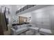 Open living room with high ceilings, modern furniture, and a loft area at 2344 Bay W St, Sarasota, FL 34237