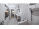 Modern bathroom with double vanity, marble tile, and walk-in shower at 2344 Bay W St, Sarasota, FL 34237