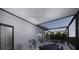 Outdoor kitchen and dining area with covered patio and pool access at 2344 Bay W St, Sarasota, FL 34237