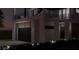 Two-car garage with modern design and exterior lighting at 2344 Bay W St, Sarasota, FL 34237