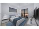 Bright bedroom with access to a private balcony and modern decor at 2344 Bay W St, Sarasota, FL 34237