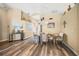 Casual dining area with wood flooring and a view into the kitchen at 5201 Highbury Cir, Sarasota, FL 34238