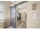 Walk-in closet with barn door and ample storage shelving at 5201 Highbury Cir, Sarasota, FL 34238