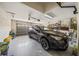 Garage with car, storage shelves, and ample space at 5201 Highbury Cir, Sarasota, FL 34238