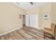 Well-lit bedroom with double doors to closet and hardwood floors at 5201 Highbury Cir, Sarasota, FL 34238
