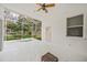 Screened-in patio with hot tub and backyard access at 5201 Highbury Cir, Sarasota, FL 34238
