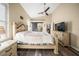 Spacious bedroom with a king-size bed, ceiling fan, and built-in dresser at 5201 Highbury Cir, Sarasota, FL 34238